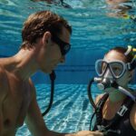 Leonardo_Kino_XL_A_diligently_instructing_diving_instructor_as_1