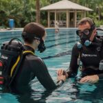 Leonardo_Kino_XL_A_diligently_instructing_diving_instructor_as_3